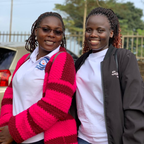 Chebira Esther and Olivia Nassiwa smiling athe camera